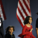 Democratic then-presidential candidate Barack Obama and his family arrive on stage for his election night victory rally on November 4, 2008, in Chicago, Illinois.
